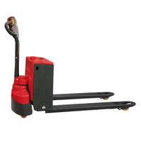 Red and black pallet jack on a white background