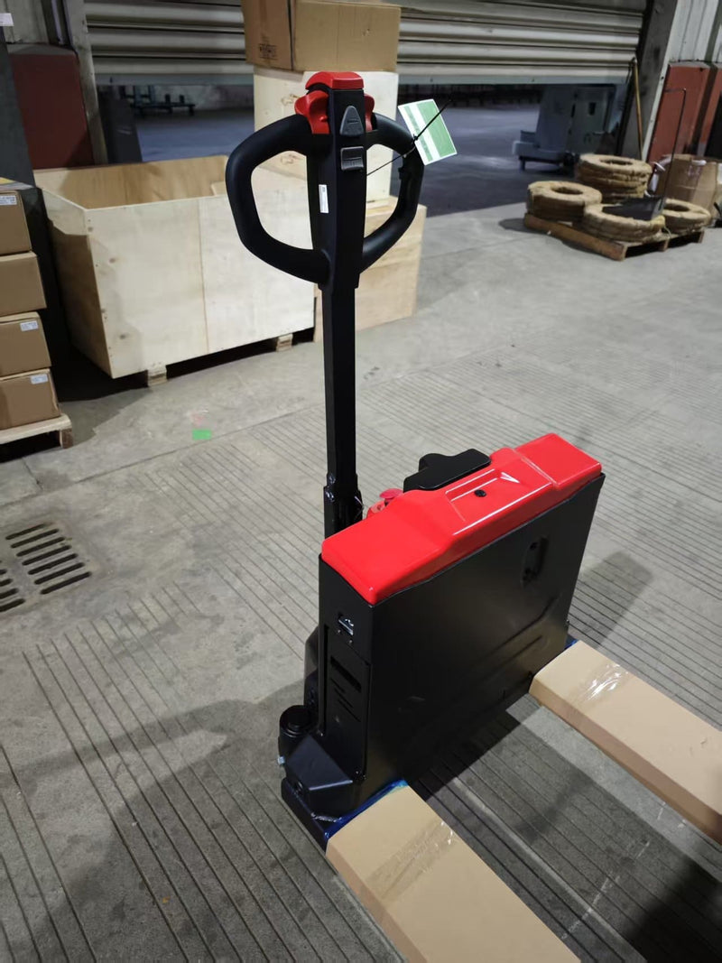 Three-quarter view of the CBD20W-II from the fork end showing the battery housing side panel, charging port area and upright tiller handle