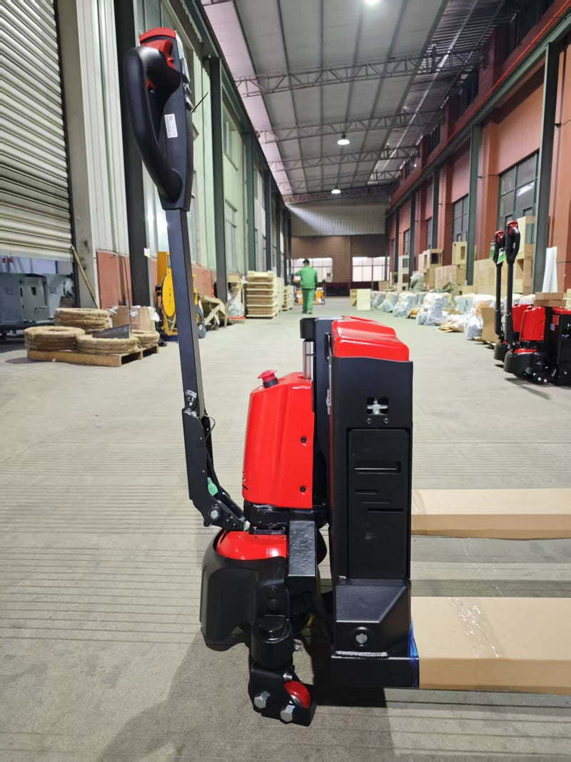 Side view of the CBD20W-II with the handle upright, showing the battery housing side panel, drive wheel unit and the start of the forks