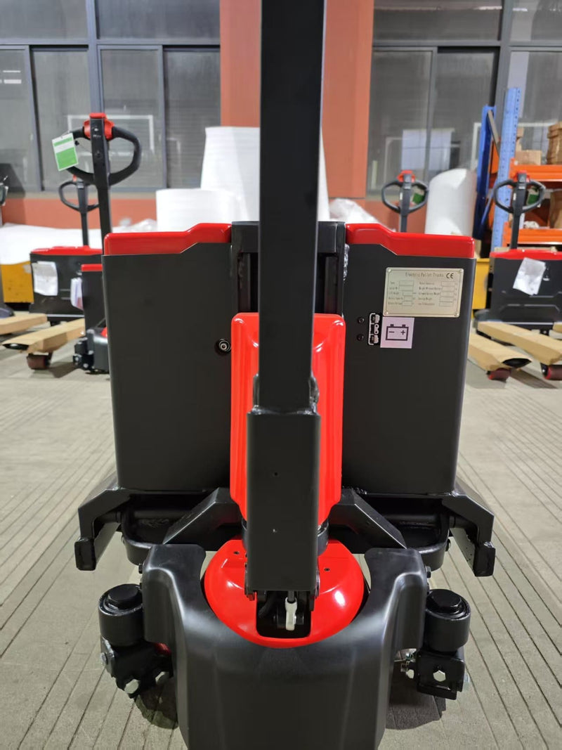 Operator-end view of the CBD20W-II showing the handle shaft, red drive motor cover, CE nameplate, battery label and drive wheel housing
