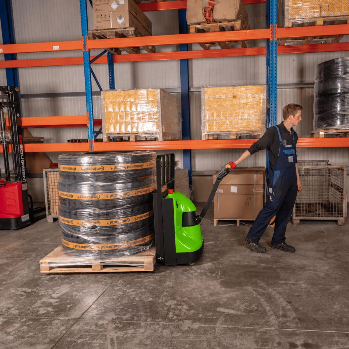 Raelon EPT25-WA electric pallet jack moving pallet loads in a warehouse
