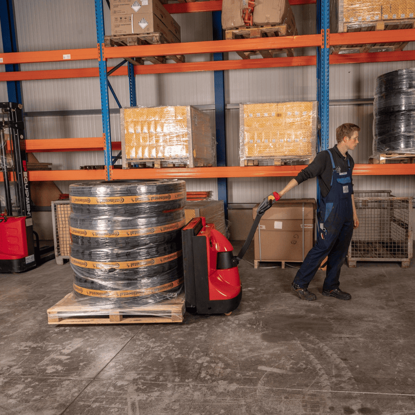 Raelon EPT25-WA electric pallet jack moving pallet loads in a warehouse