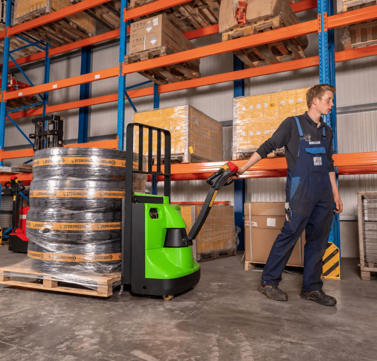 Raelon EPT25-WA electric pallet jack moving pallet loads in a warehouse