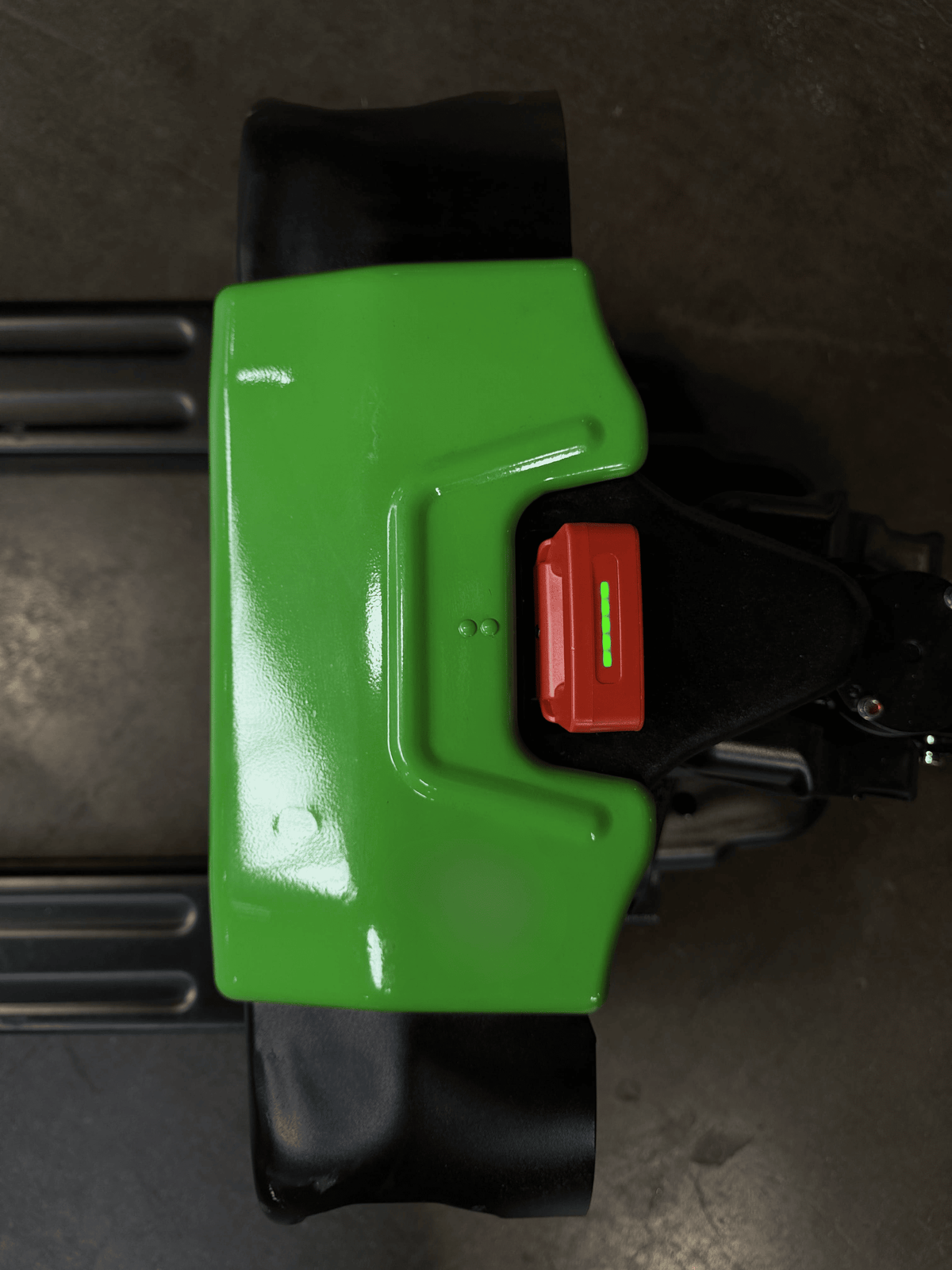 Top body view of Raelon F4 electric pallet jack with emergency stop button