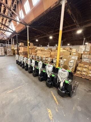 Raelon F4 3300 lb electric pallet jack displayed in a warehouse setting