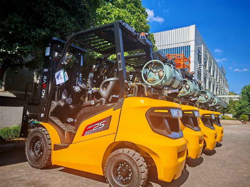 Raelon FL25T 5,500 lbs LPG forklifts lined up at the warehouse, rear three-quarter view