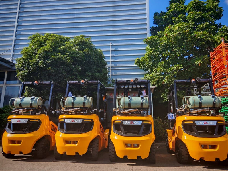 Four Raelon FL35T 7,700 lbs LPG forklifts lined up outdoors – rear view