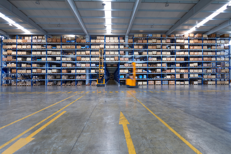 Large warehouse with high shelves filled with boxes