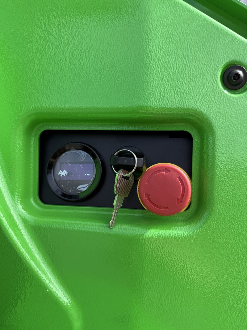 Close-up of the WPL202 display, key switch and red emergency stop button on the green cover