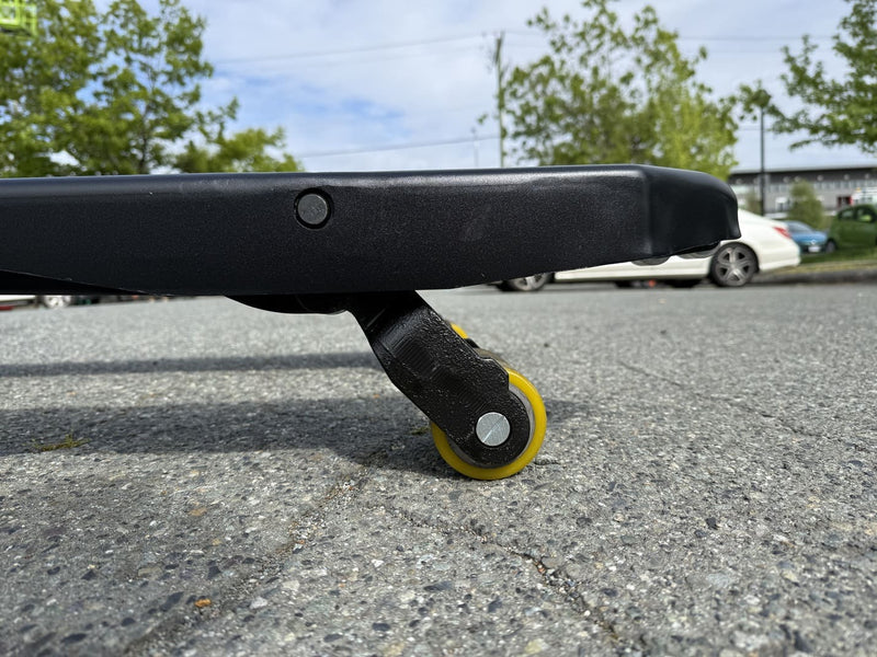 Low-angle close-up of the WPL202 fork-tip load wheel with yellow tread