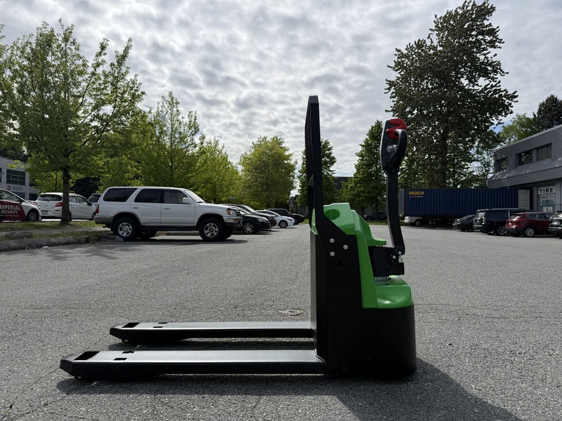 Side view of the WPL202 with the load backrest, green cover, raised tiller handle and forks pointing left